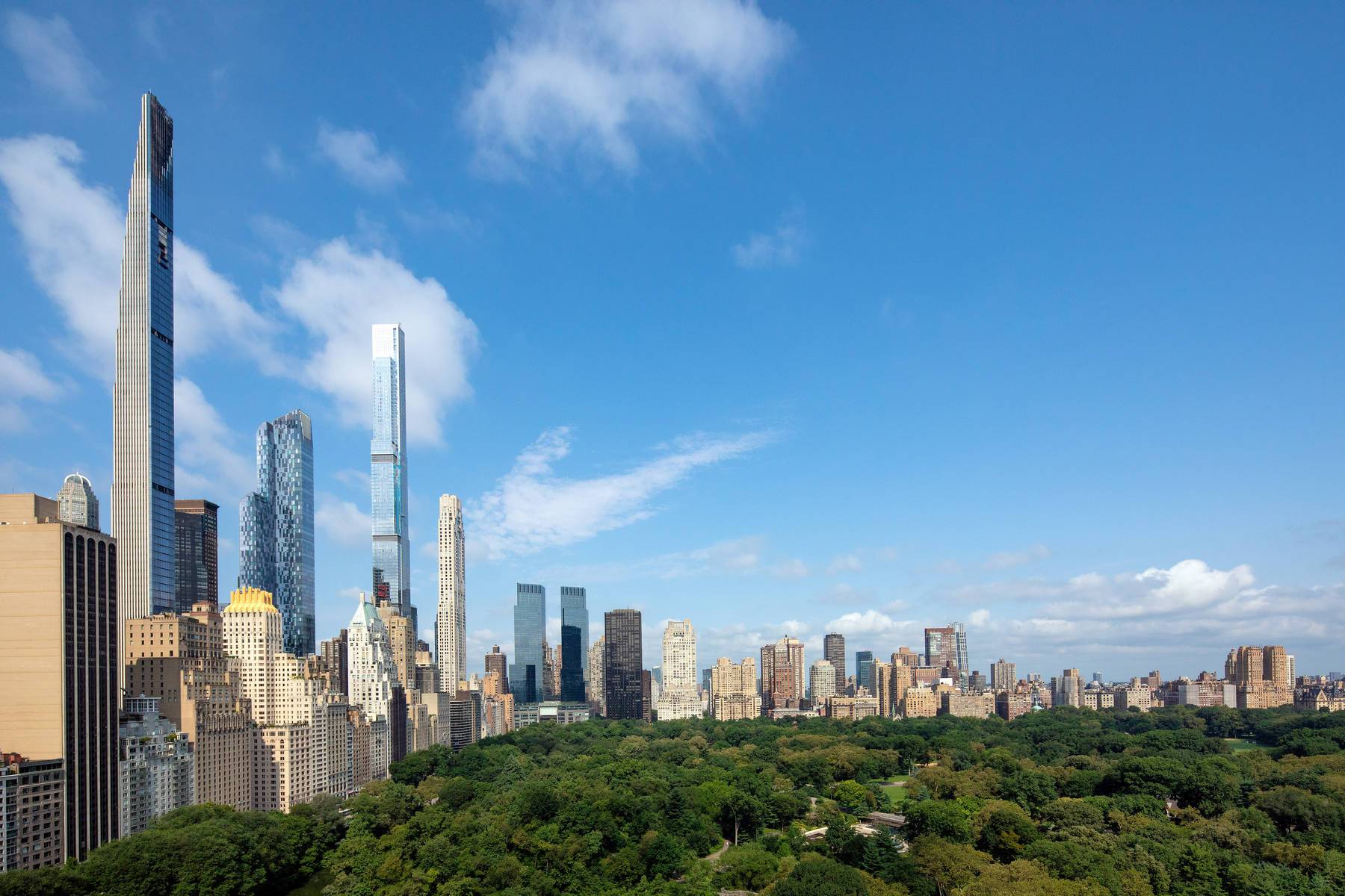 City views from 800 Fifth Avenue with buildings and Central Park and blue skies