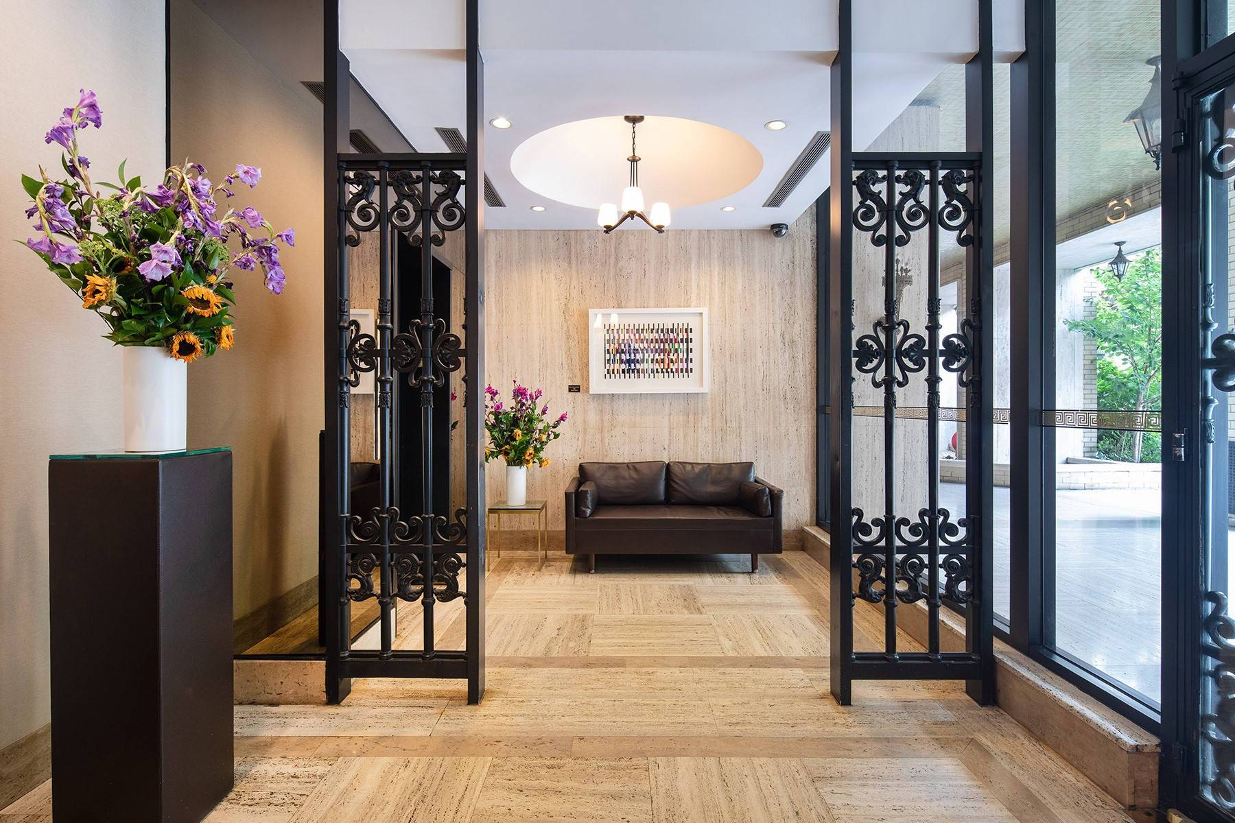 Lobby Entrance with iron gate details and couch seating at 985 Fifth Avenue